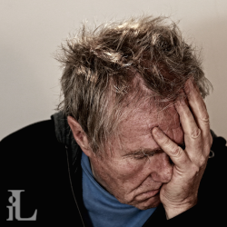 An image of a man with a headache.